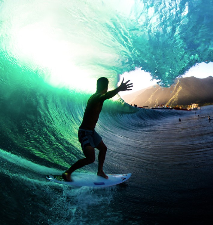 Surfer catching a wave at Onslow Beach